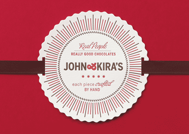 Package design for John & Kira's chocolates. Red box with a letterpressed label.
